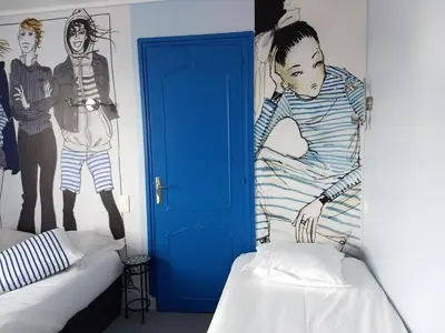 Un ou plusieurs lits dans un hébergement de l'établissement Hôtel Patton