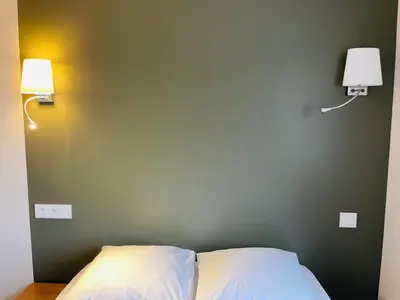 Un ou plusieurs lits dans un hébergement de l'établissement Restaurant Hotel Logis Chez Sophie