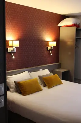 Un ou plusieurs lits dans un hébergement de l'établissement Hôtel Crocus Caen Mémorial