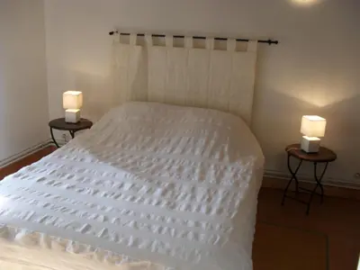 Un ou plusieurs lits dans un hébergement de l'établissement Chambres d'hôtes Au Hameau