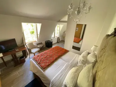 Un ou plusieurs lits dans un hébergement de l'établissement Hôtel Victor Hugo