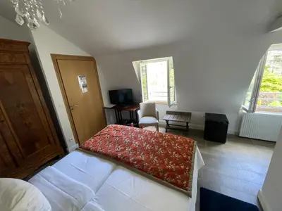 Un ou plusieurs lits dans un hébergement de l'établissement Hôtel Victor Hugo