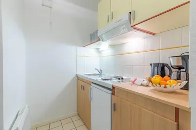 Cuisine ou kitchenette dans l'établissement Appart'City Classic Caen