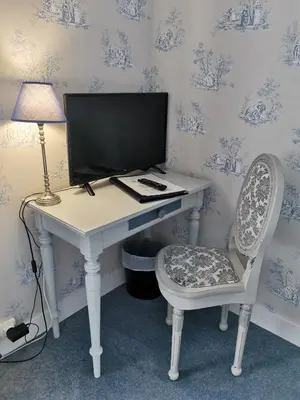 Télévision ou salle de divertissement dans l'établissement La Granitiere Maison de Charme