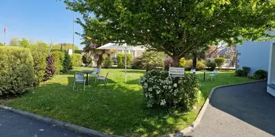 Jardin de l'établissement Logis Hôtel Au Moyne de Saire