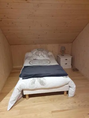 Un ou plusieurs lits dans un hébergement de l'établissement Gite de la Daniere
