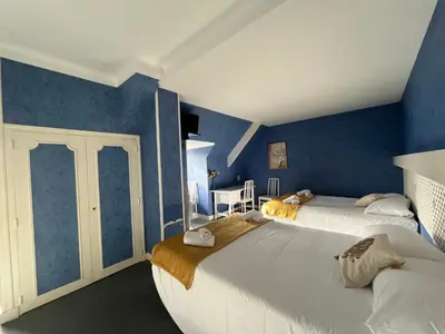 Un ou plusieurs lits dans un hébergement de l'établissement Hôtel Le Phare