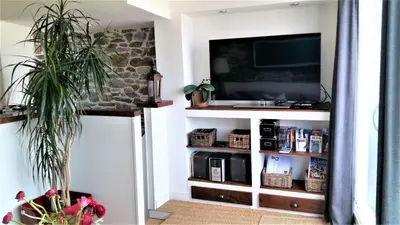Télévision ou salle de divertissement dans l'établissement Duplex Terrasse Garage