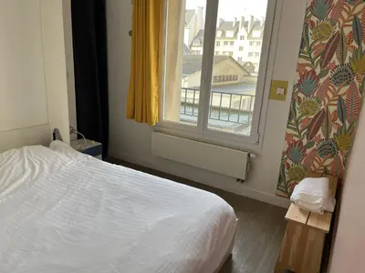 Un ou plusieurs lits dans un hébergement de l'établissement Appartements Caen Centre