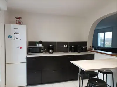 Cuisine ou kitchenette dans l'établissement La Petite Baie