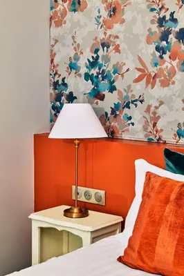 Un ou plusieurs lits dans un hébergement de l'établissement Logis Hotel Les Fuchsias