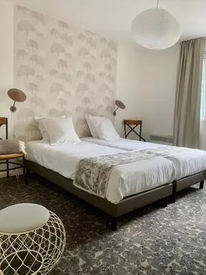 Un ou plusieurs lits dans un hébergement de l'établissement Hotel Chantereyne