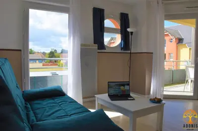 Télévision ou salle de divertissement dans l'établissement Adonis Grandcamp - Résidence Les Isles De Sola