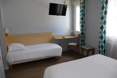 Un ou plusieurs lits dans un hébergement de l'établissement Hôtel De Paris