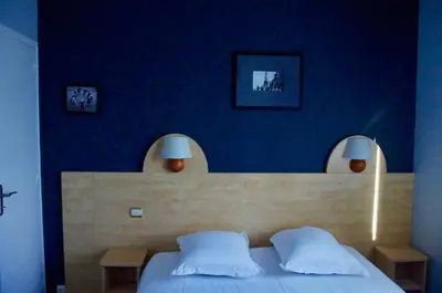 Un ou plusieurs lits dans un hébergement de l'établissement Hôtel De Paris