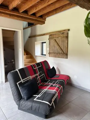 Coin salon dans l'établissement La grange de la vallée