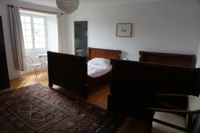 Un ou plusieurs lits dans un hébergement de l'établissement Manoir de la Guerrie