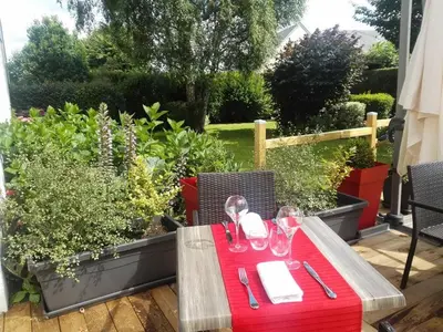Jardin de l'établissement Logis Hôtel Restaurant Le Gue Du Holme