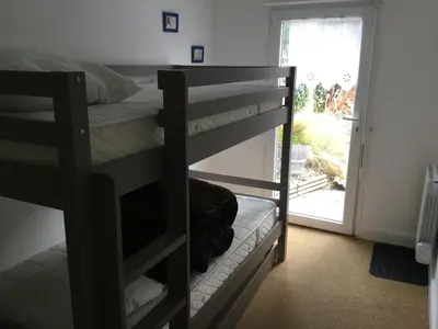 Un ou plusieurs lits dans un hébergement de l'établissement Maison proche du port