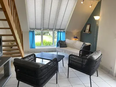 Coin salon dans l'établissement Holiday Home Côte des îles by Interhome