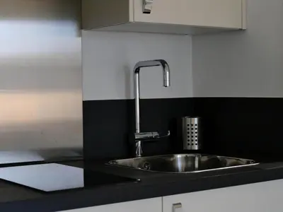 Cuisine ou kitchenette dans l'établissement Appart'hôtel Chambrappart