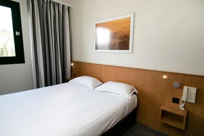 Un ou plusieurs lits dans un hébergement de l'établissement Hôtel Vert