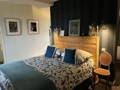 Un ou plusieurs lits dans un hébergement de l'établissement Le Manoir du Ribardon