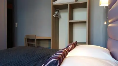 Un ou plusieurs lits dans un hébergement de l'établissement Hotel Napoléon