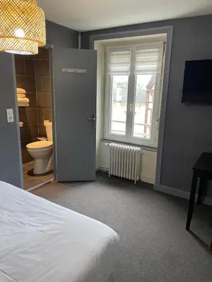 Un ou plusieurs lits dans un hébergement de l'établissement Beau Rivage Hôtel-Restaurant