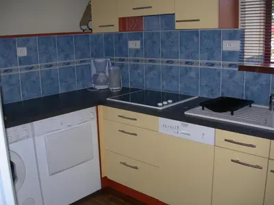 Cuisine ou kitchenette dans l'établissement la maison de Léa
