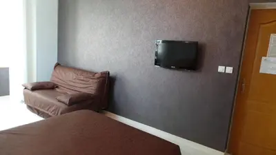 Télévision ou salle de divertissement dans l'établissement Hotel La Renaissance