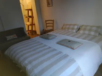 Un ou plusieurs lits dans un hébergement de l'établissement Chambre et petit déjeuner près de la mer