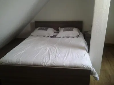 Un ou plusieurs lits dans un hébergement de l'établissement Appartement Rue Georges V - Port de la Houle
