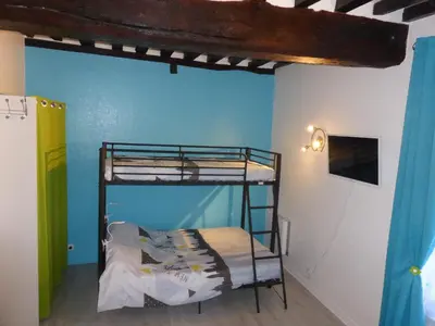 Un ou plusieurs lits dans un hébergement de l'établissement Appartement Bayeux