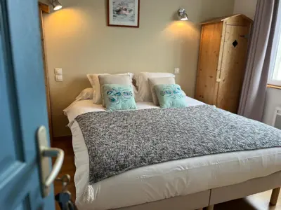 Un ou plusieurs lits dans un hébergement de l'établissement Les Transats Chambre et appartements Face à la mer