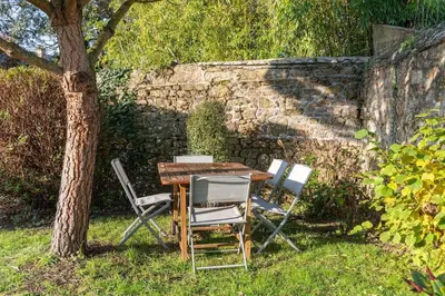 Jardin de l'établissement Le Cottage De La Baie