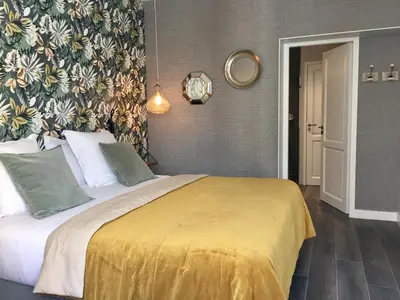 Un ou plusieurs lits dans un hébergement de l'établissement La Cotentine Maison d'Hôtes