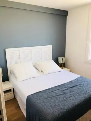 Un ou plusieurs lits dans un hébergement de l'établissement Bel Appartement vue mer