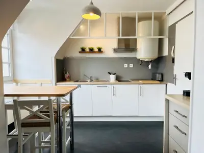 Cuisine ou kitchenette dans l'établissement Appartement cosy bord de mer
