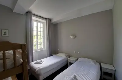 Un ou plusieurs lits dans un hébergement de l'établissement Château Baffy