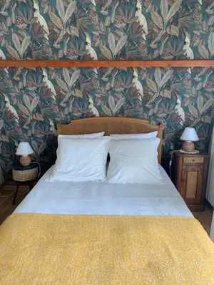 Un ou plusieurs lits dans un hébergement de l'établissement chambre normande
