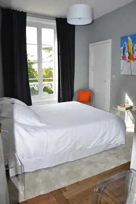 Un ou plusieurs lits dans un hébergement de l'établissement Clos de Bellefontaine B&B