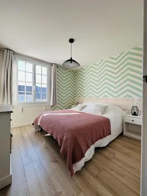 Un ou plusieurs lits dans un hébergement de l'établissement Bel appartement plein centre 100m de la mer