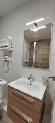 Salle de bains dans l'établissement Hotel Beau Rivage