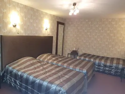 Un ou plusieurs lits dans un hébergement de l'établissement Hôtel de La Croix d'Or