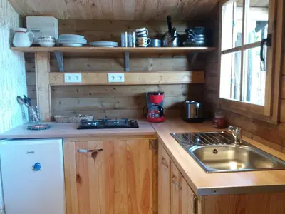 Cuisine ou kitchenette dans l'établissement Le Chalet du Clos Giot