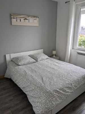 Un ou plusieurs lits dans un hébergement de l'établissement Maison de vacances cosy