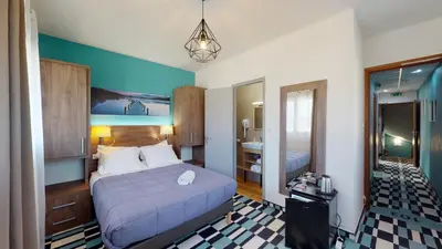 Un ou plusieurs lits dans un hébergement de l'établissement Hôtel Les Pieux En Cotentin