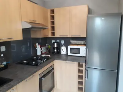 Cuisine ou kitchenette dans l'établissement Gîte 