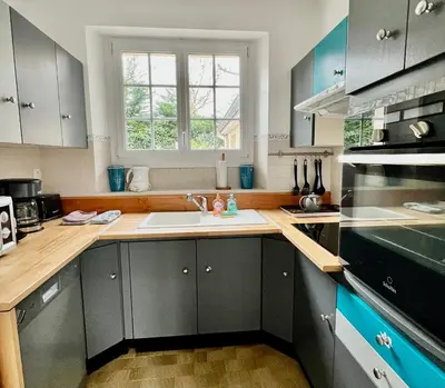 Cuisine ou kitchenette dans l'établissement La Rose Des Vents